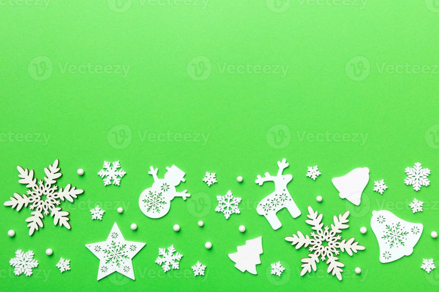 New Year composition white christmas snowflakes. Christmas decor background with pine cones. Top view with copy space photo