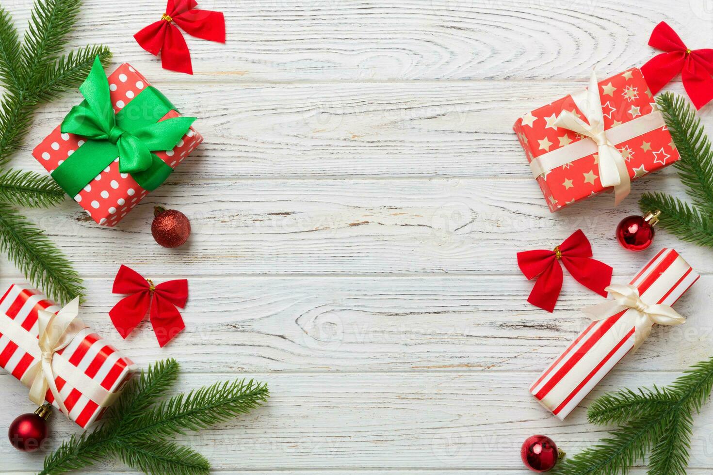 Christmas decorations and fir tree branch and gift boxon dark table. Top view frame with copy space photo