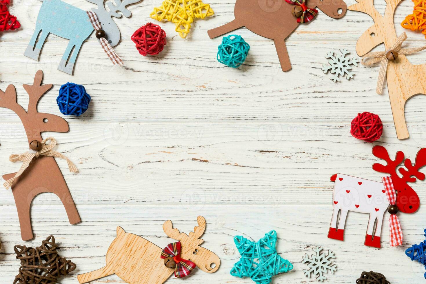 Top view of Christmas decorations and toys on wooden background. Copy space. Empty place for your design. New Year concept photo