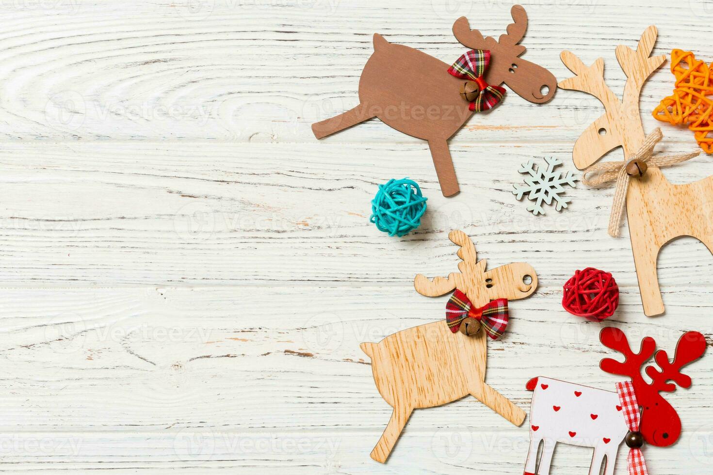 Top view of Christmas decorations and toys on wooden background. Copy space. Empty place for your design. New Year concept photo