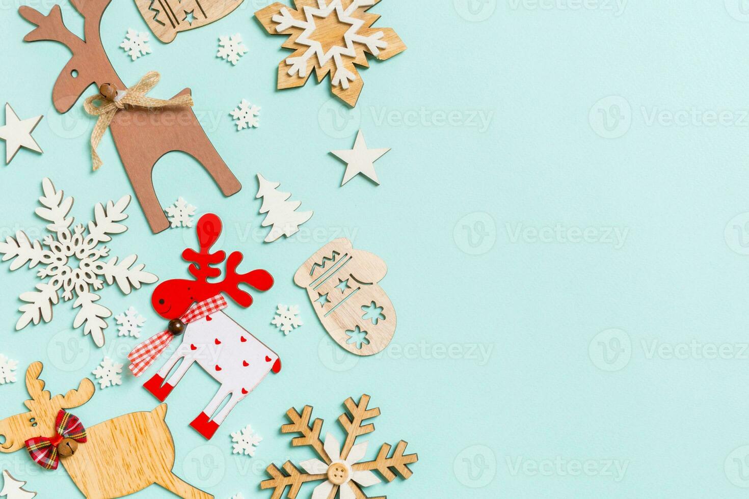 Top view of holiday decorations and toys on blue background. Christmas ornament concept with empty space for your design photo