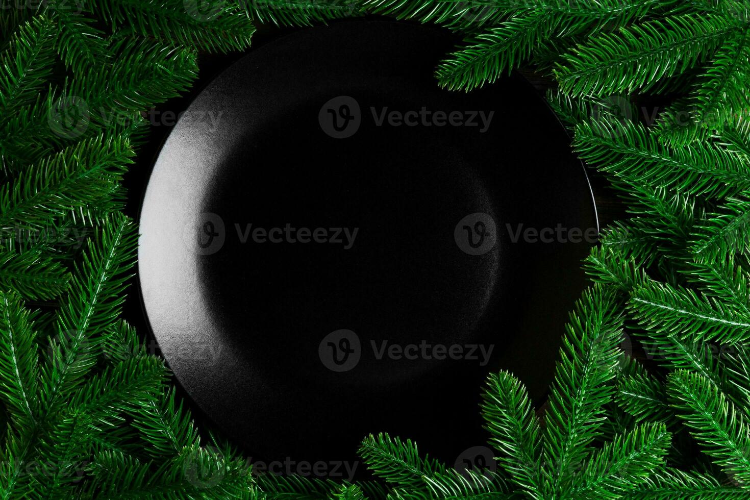 Top view served plate with green fir tree branches. Holiday dinner concept with copy space photo