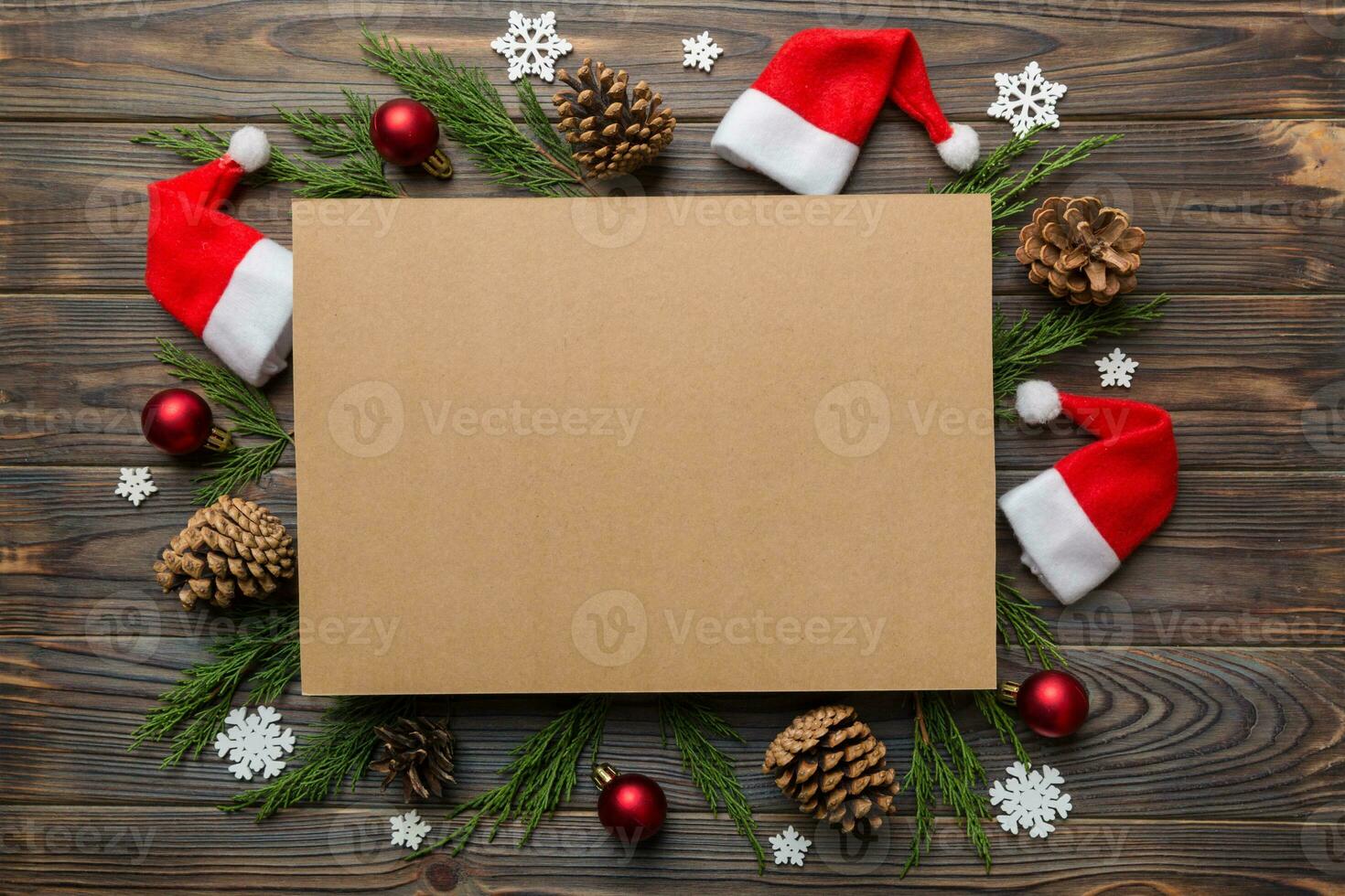 Flat lay Christmas composition. square Paper blank, pine tree branches, christmas decorations on Colored background. Top view, copy space for text photo