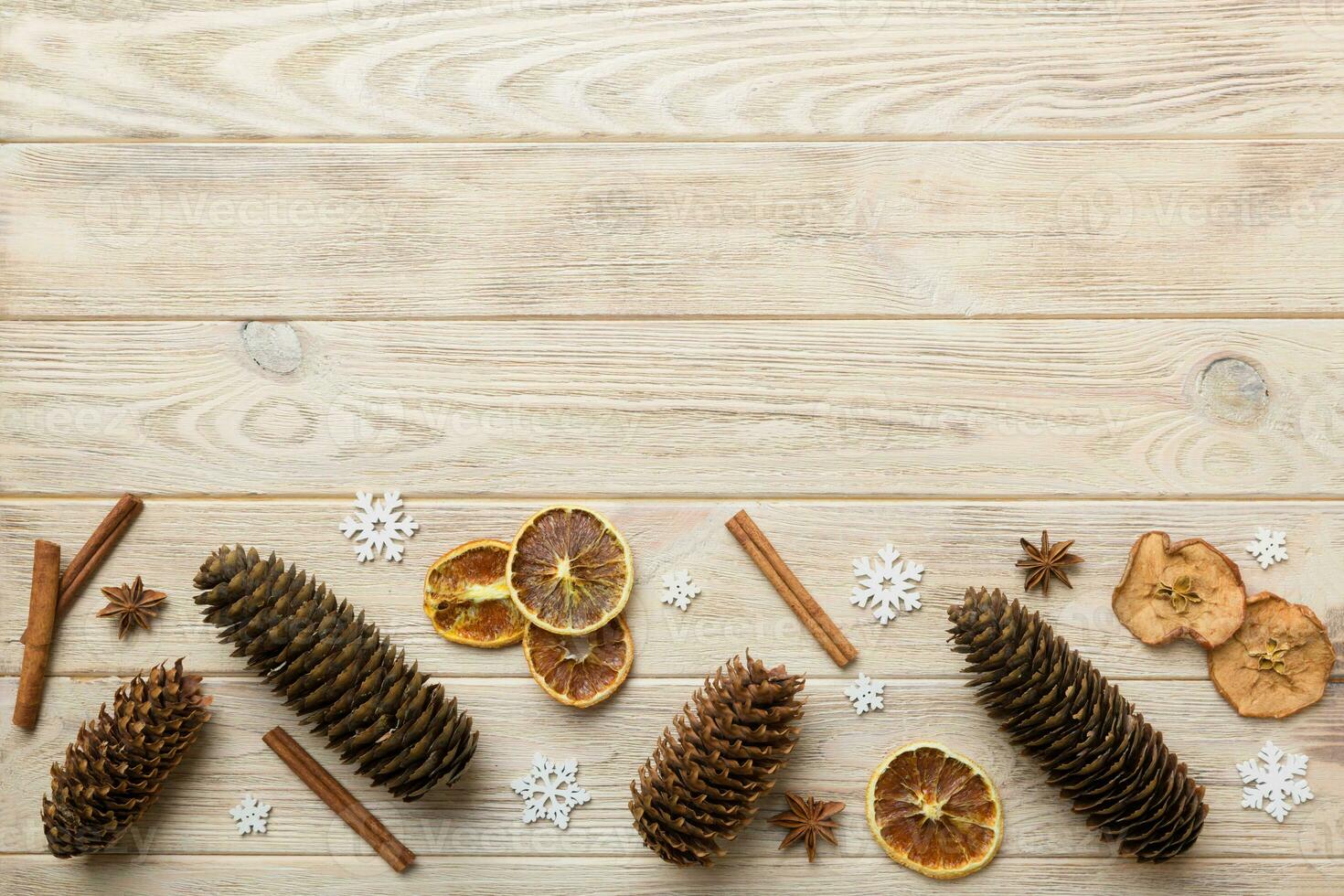 New Year composition. Christmas decor background with pine cones. Top view with copy space photo