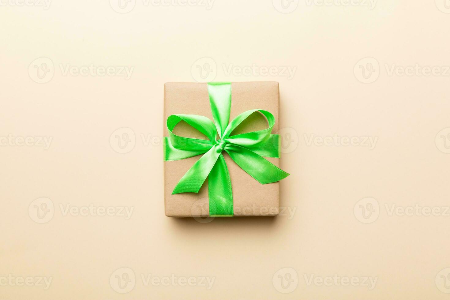 Holiday present box over colored background, top view. Copy space for design photo