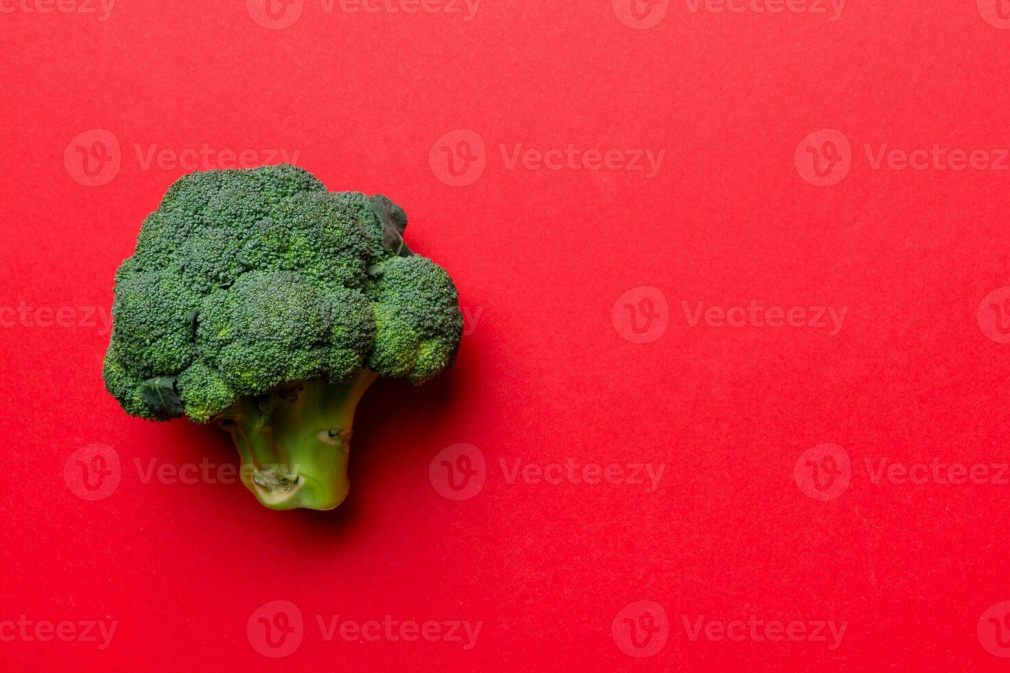Top view fresh green broccoli vegetable on Colored background. Broccoli cabbage head Healthy or vegetarian food concept. Flat lay. Copy space photo
