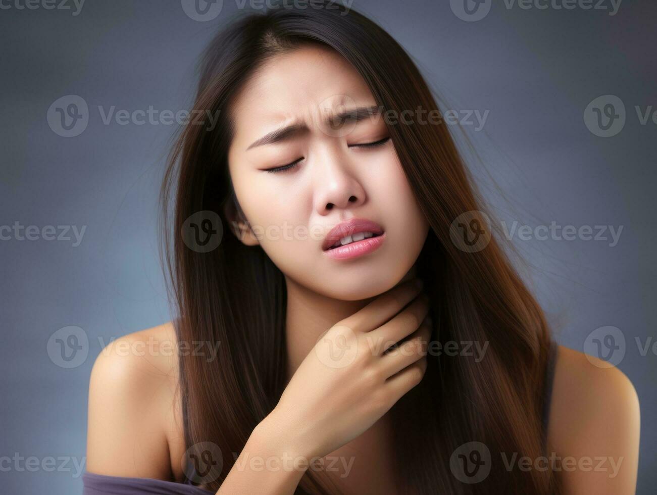 Asian woman appears to be in pain on grey background AI Generative photo