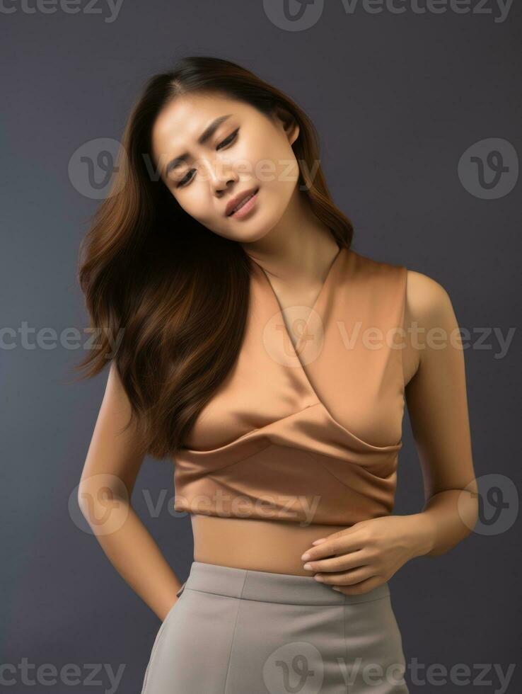 Asian woman appears to be in pain on grey background AI Generative photo