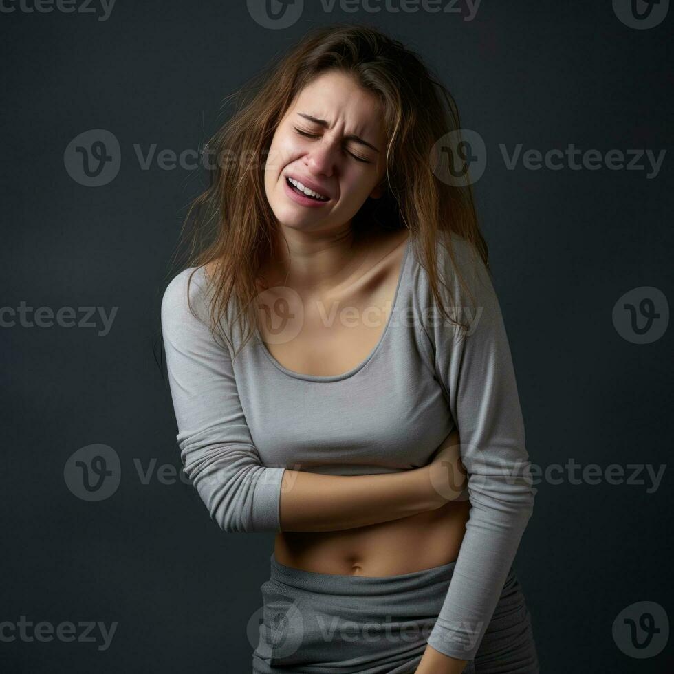 Woman appears to be in pain on grey background AI Generative photo