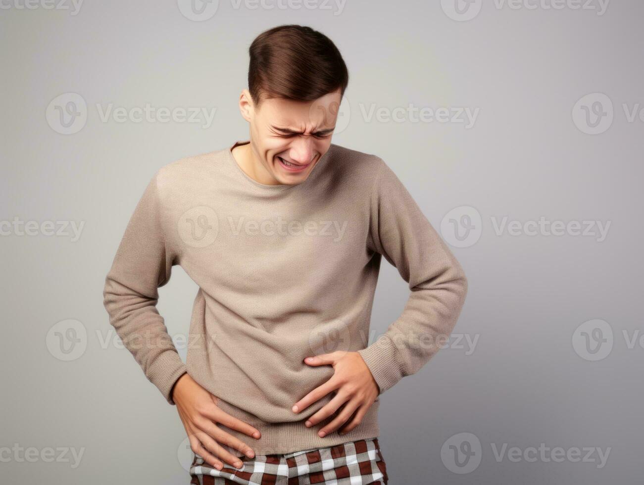 Man with stomachache on neutral background AI Generative photo