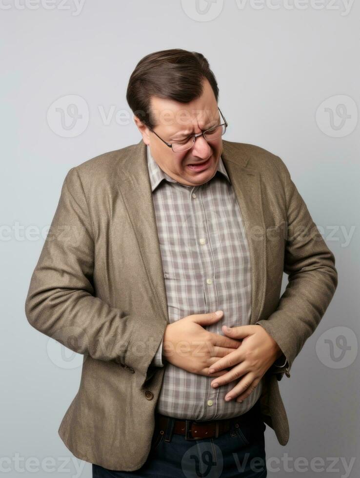Man with stomachache on neutral background AI Generative photo