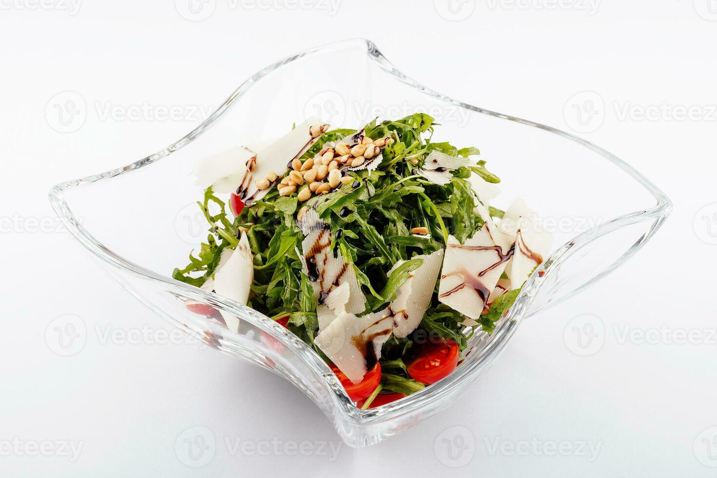 Arugula salad with sunflower kernels and sprinkled with grated parmesan photo