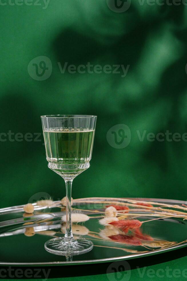 tincture in a glass on a tray photo