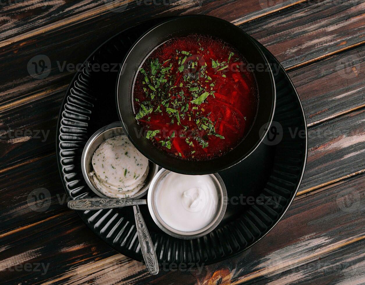 Ukrainian cuisine - borscht with sour cream photo