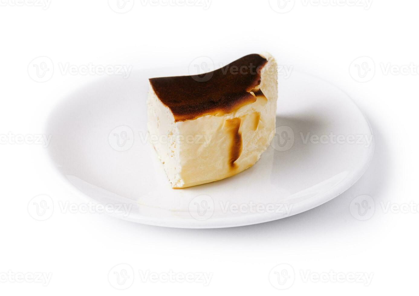 San sebastian cheesecake on plate isolated photo