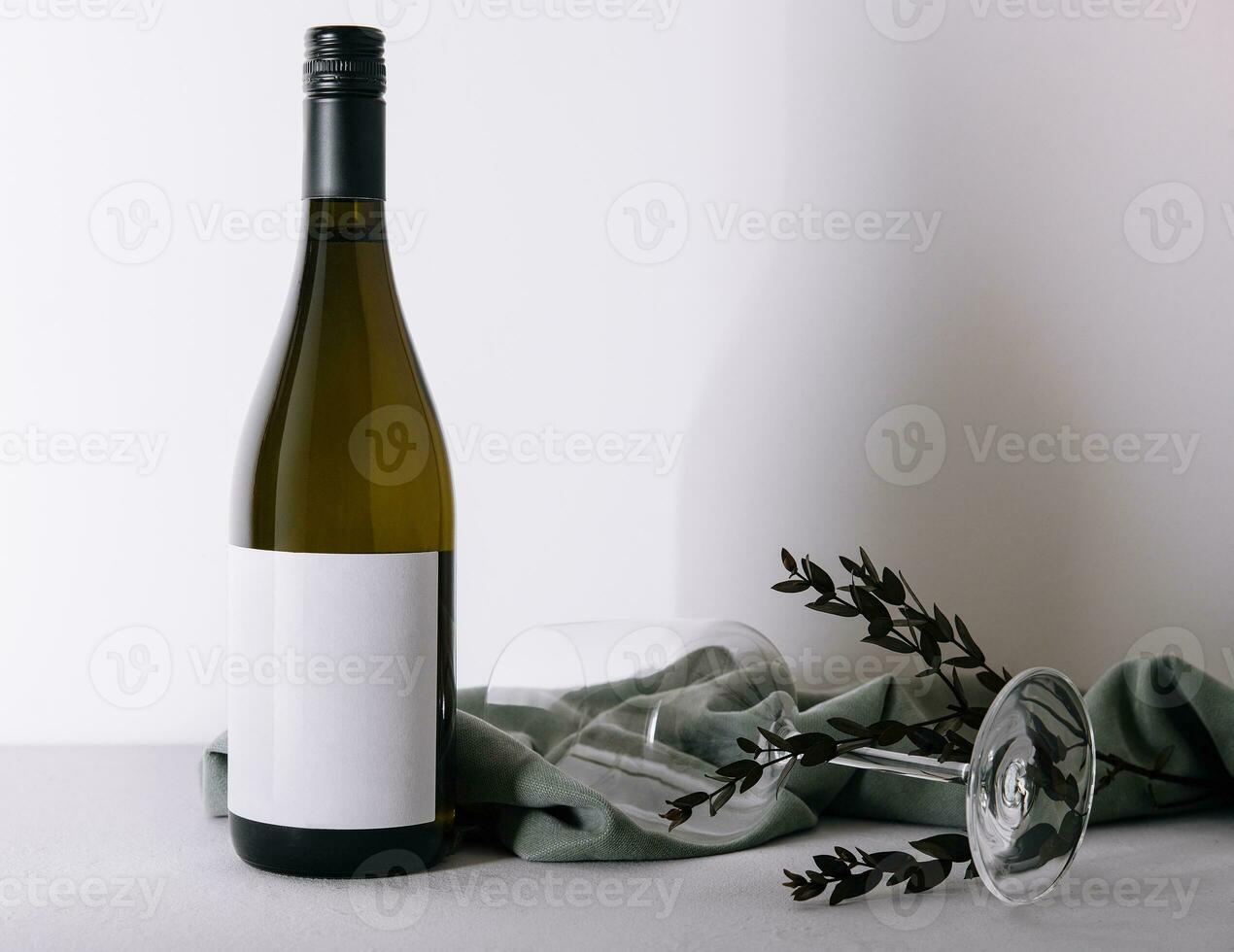 Bottle of white wine with glass photo