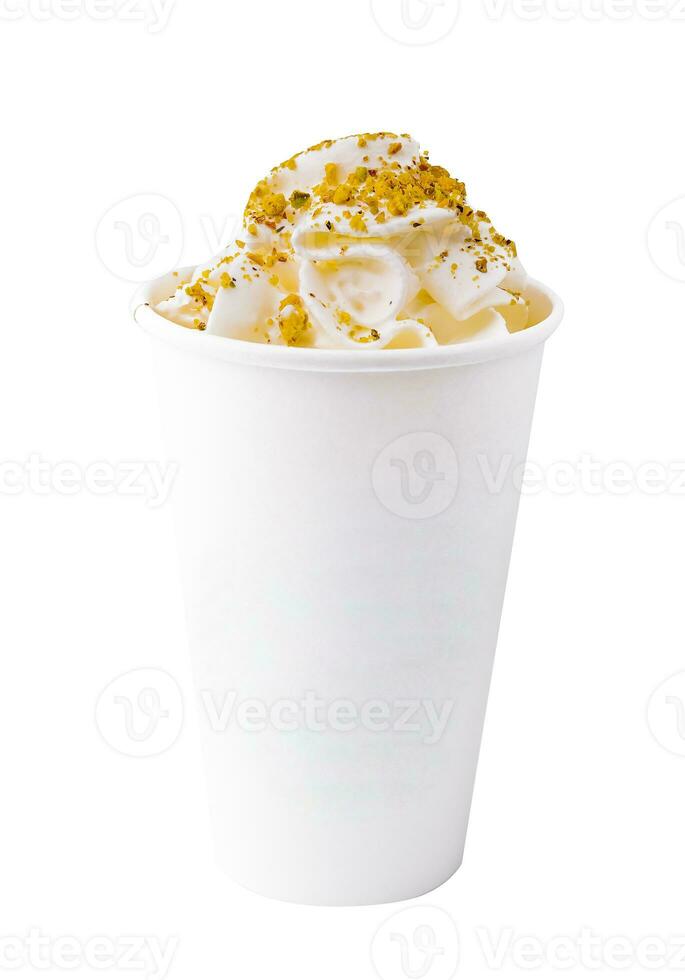 Coffee with pistachios and cream in a paper cup photo