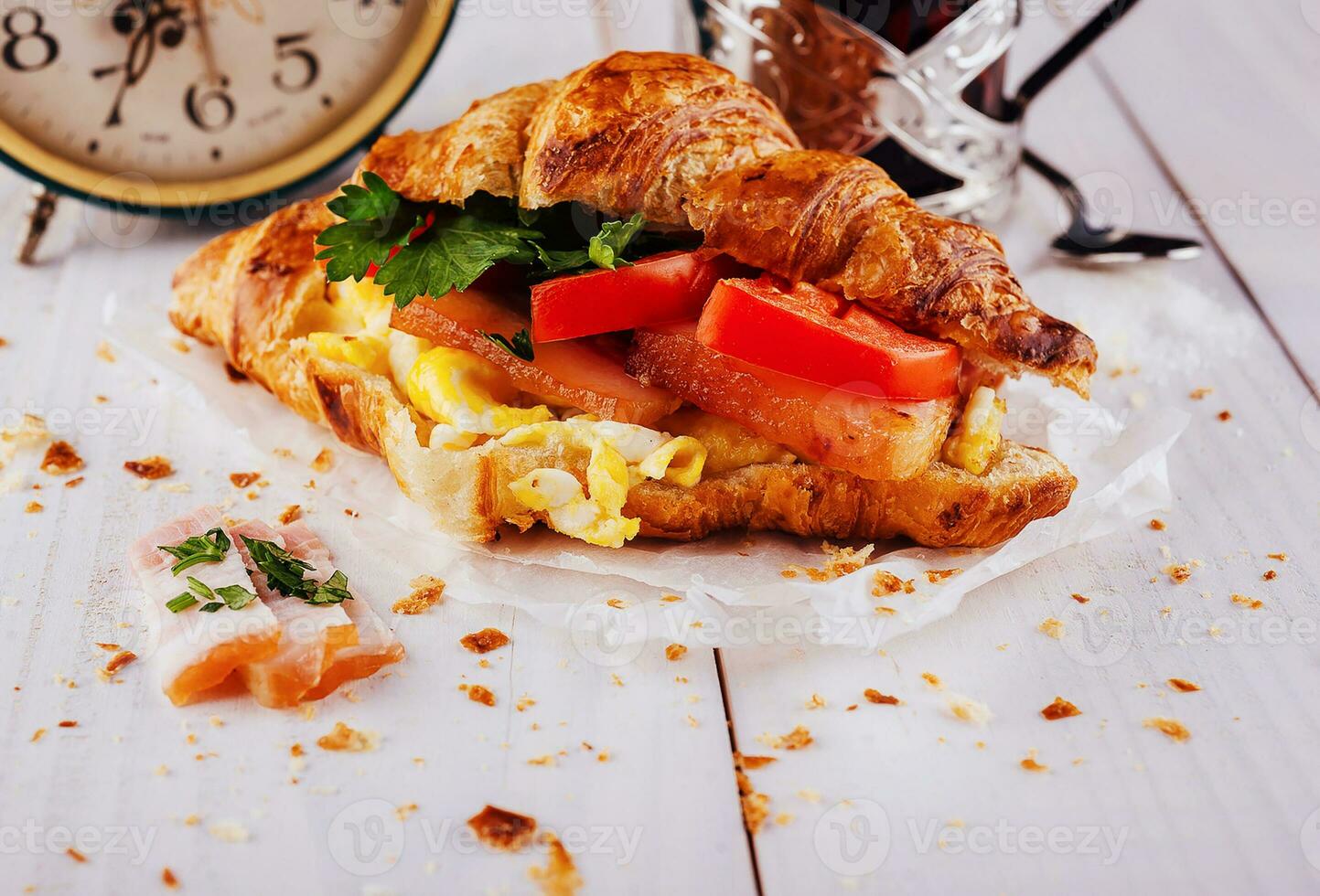 Bacon lettuce tomato sandwich croissant close up photo