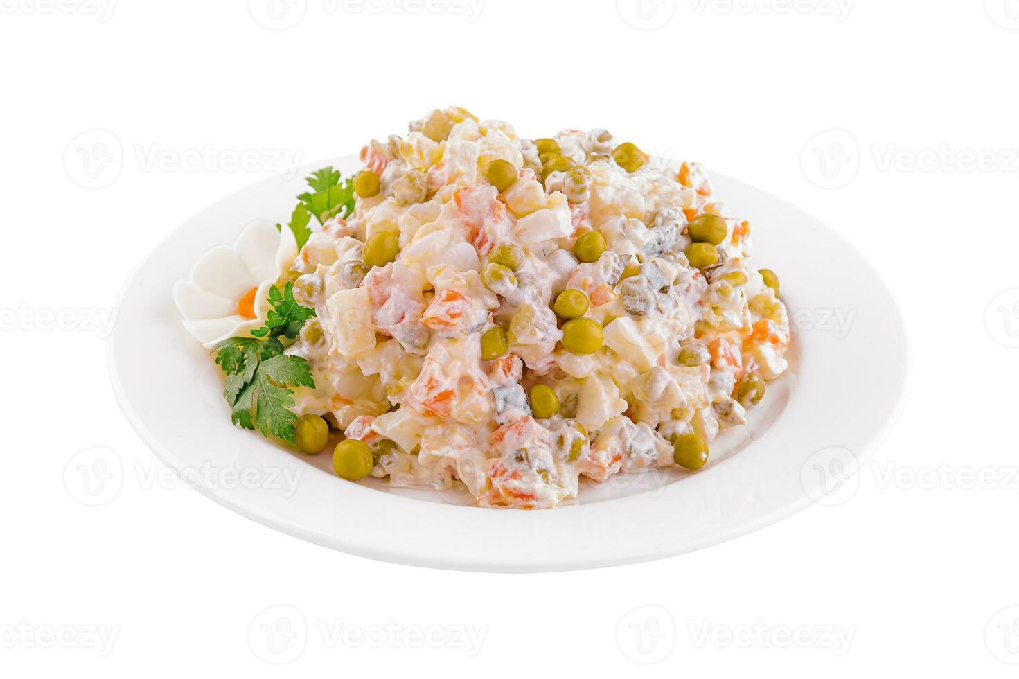 salad Olivier with mayonnaise on plate photo