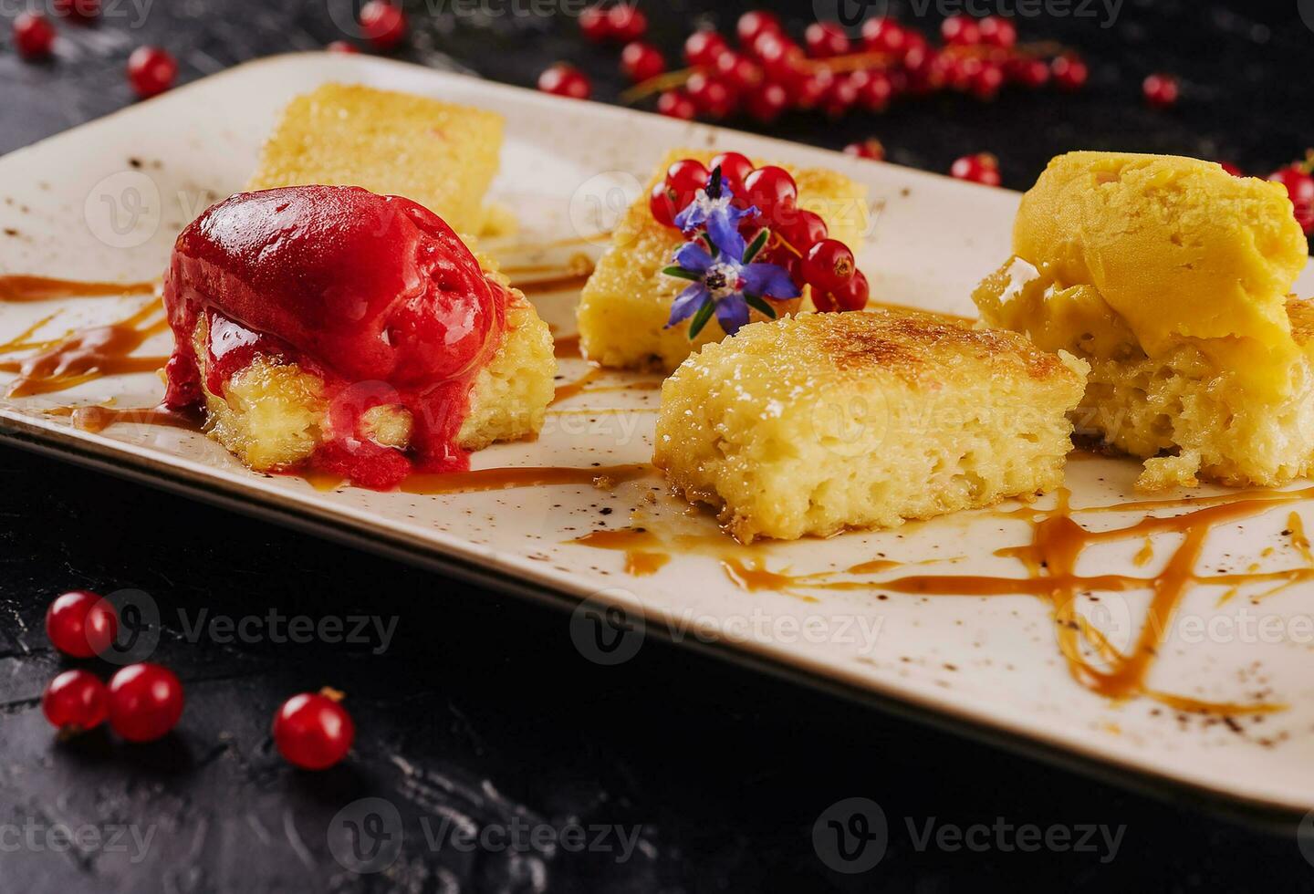 biscuit with vanilla ice cream decorated with cranberry jam photo