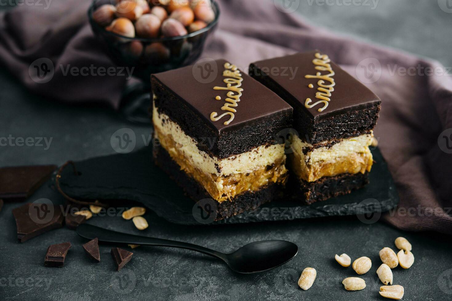 Fluffy snickers cake on stone board photo