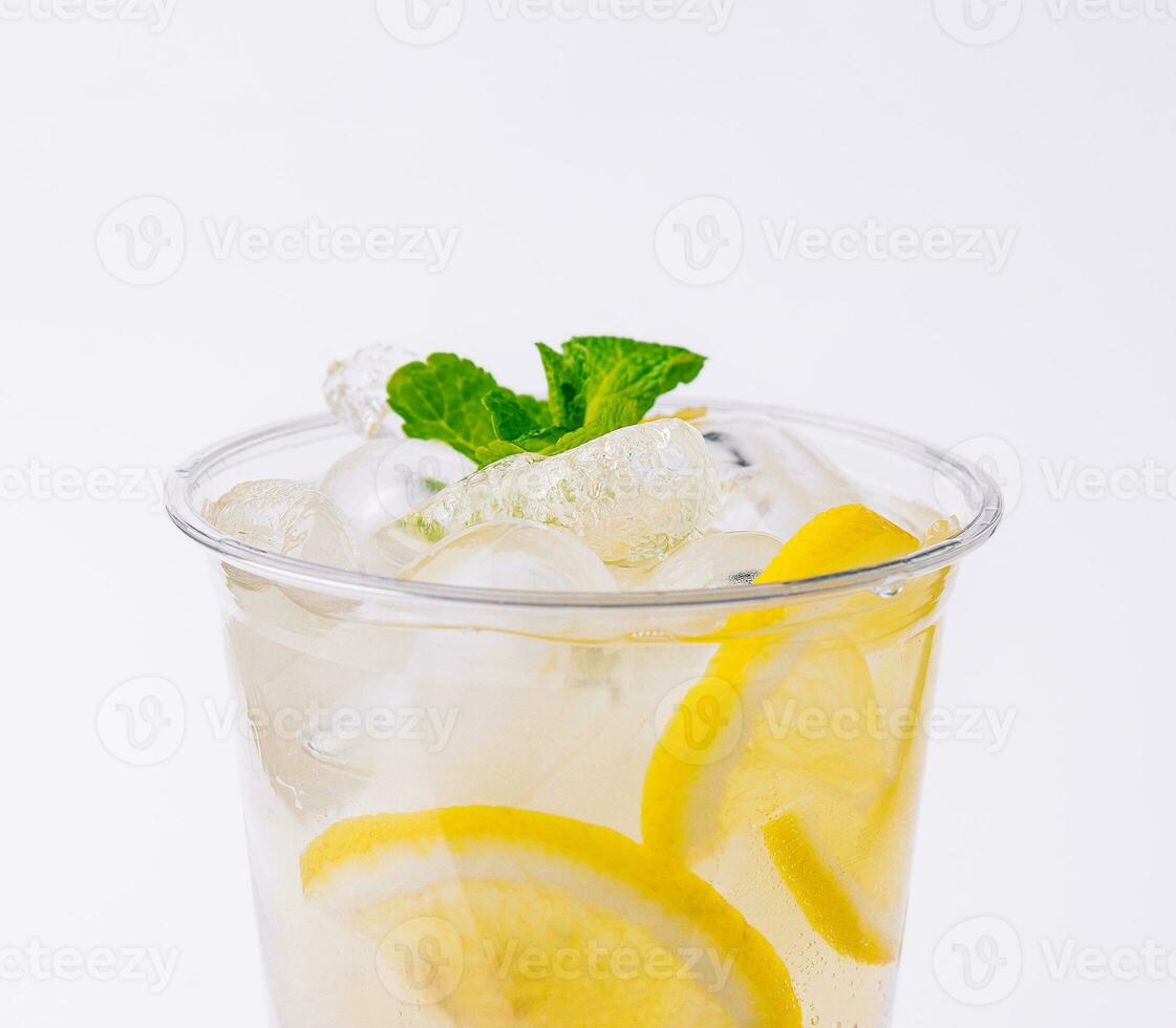 seltzer cocktail with orange, mint and ice cubes photo