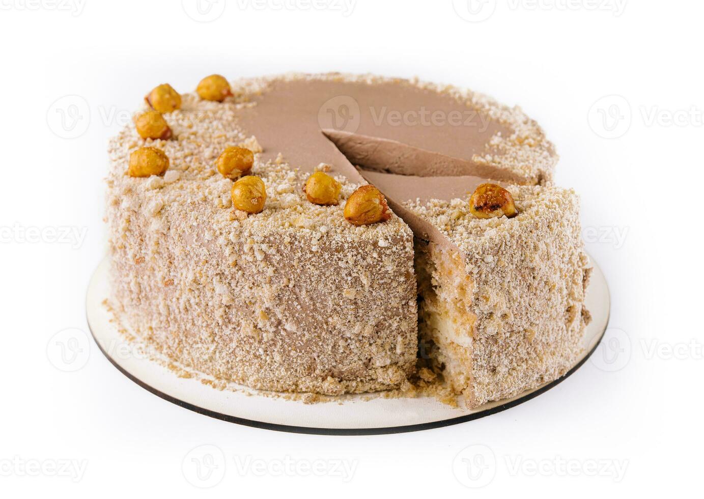 Kiev cake with hazelnut on white plate top view photo