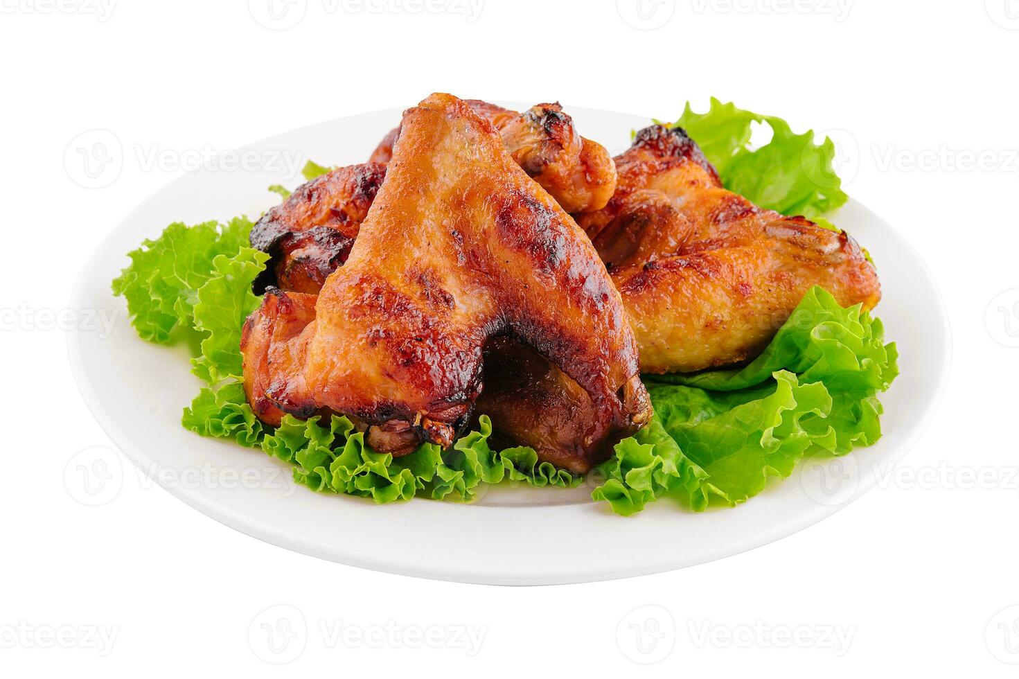 alitas de pollo frito en plato blanco foto