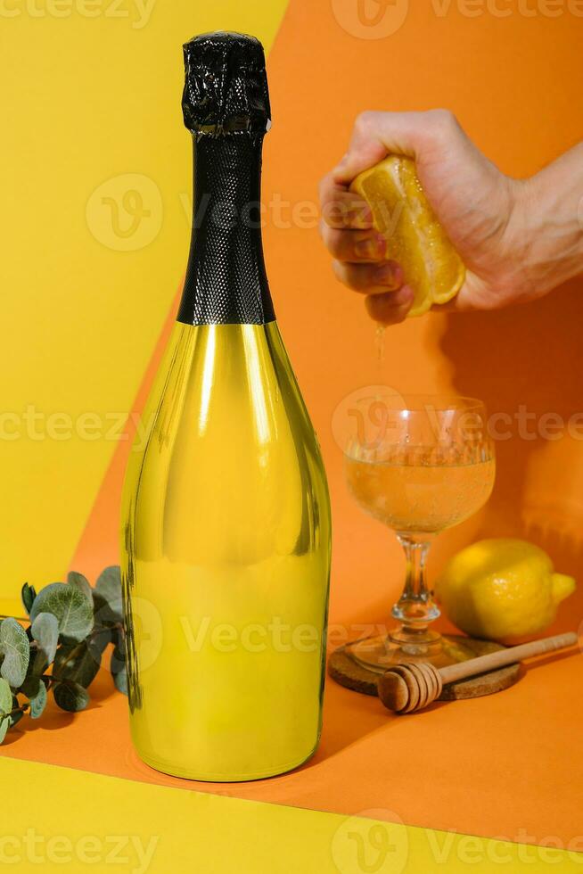 glass of champagne on a yellow and orange background photo