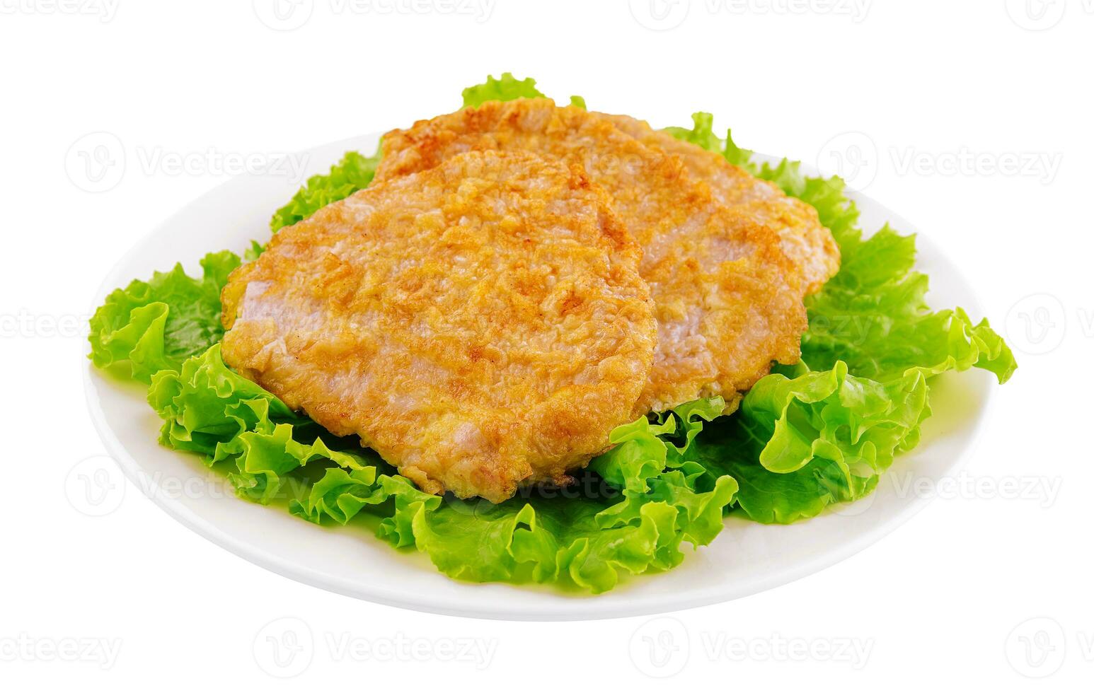 Fried chicken chop on lettuce leaves photo