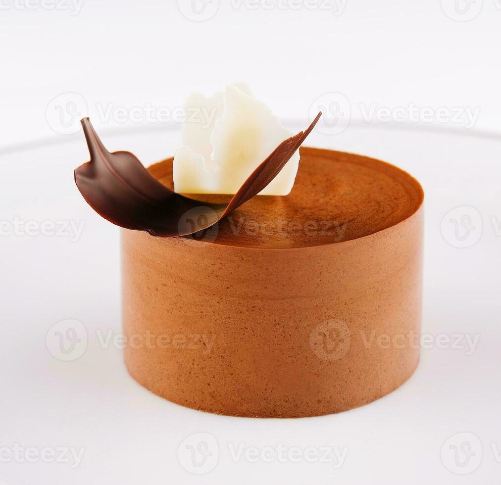 Plate with coffee panna cotta on white photo