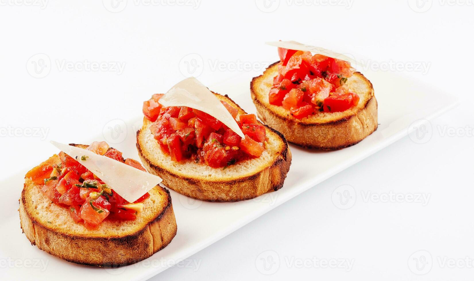 Traditional italian antipasto bruschetta appetizer with cherry tomatoes photo