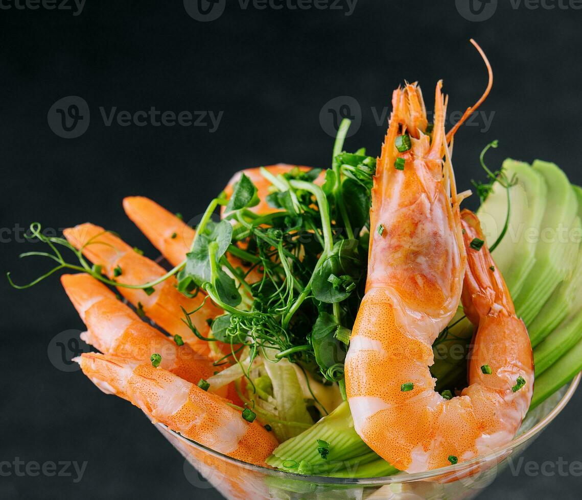 shrimp and avocado pieces in a martini glass photo