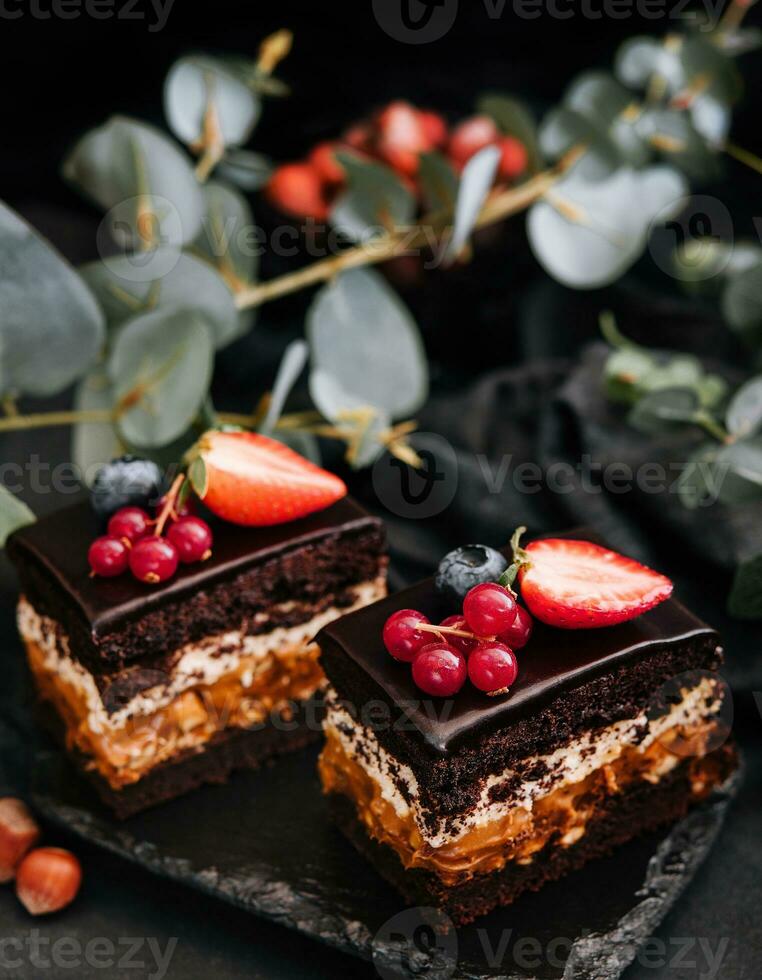 Delicious chocolate cake decorated with fresh berries photo