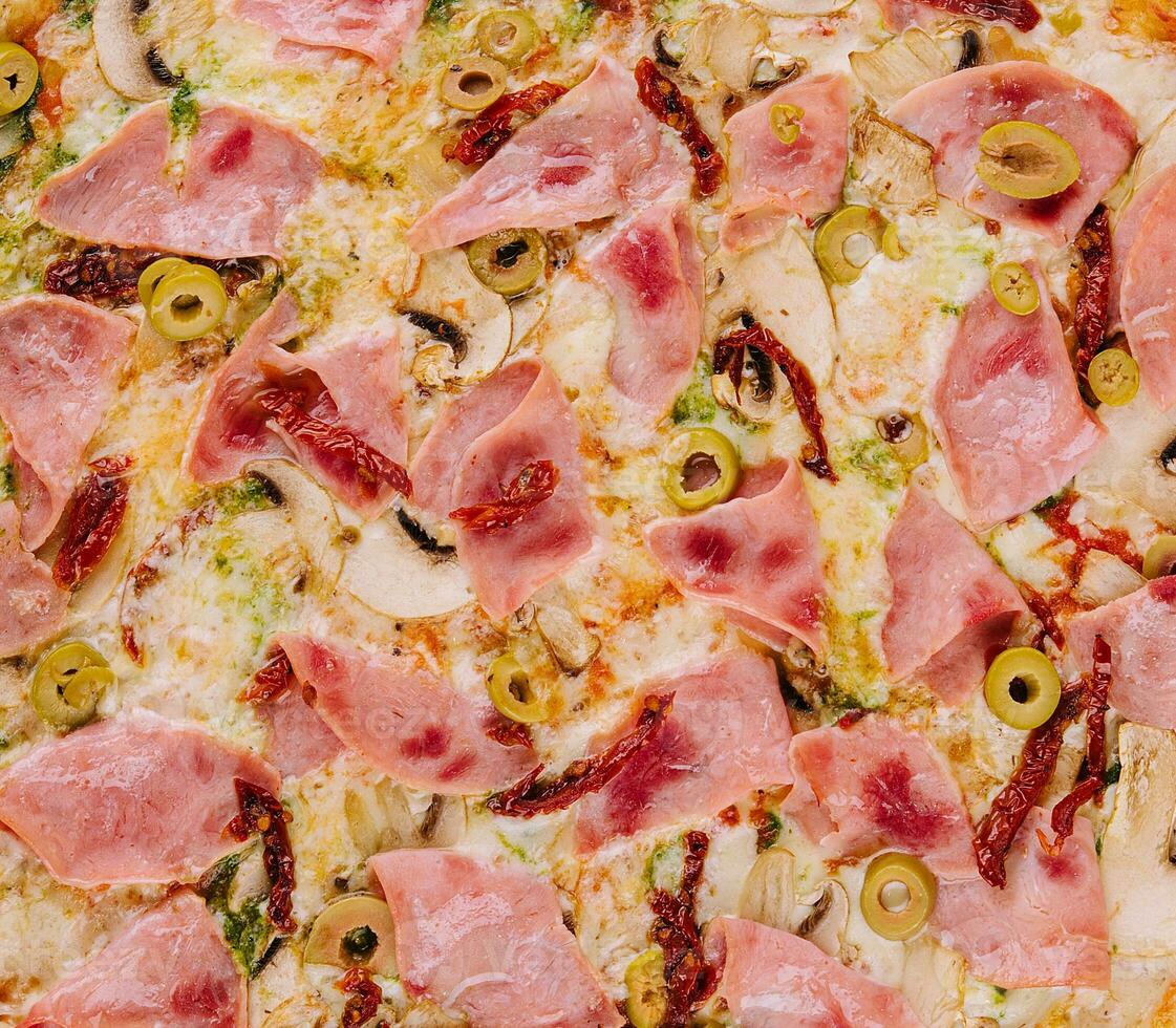 Pizza ham and mushroom close up background photo