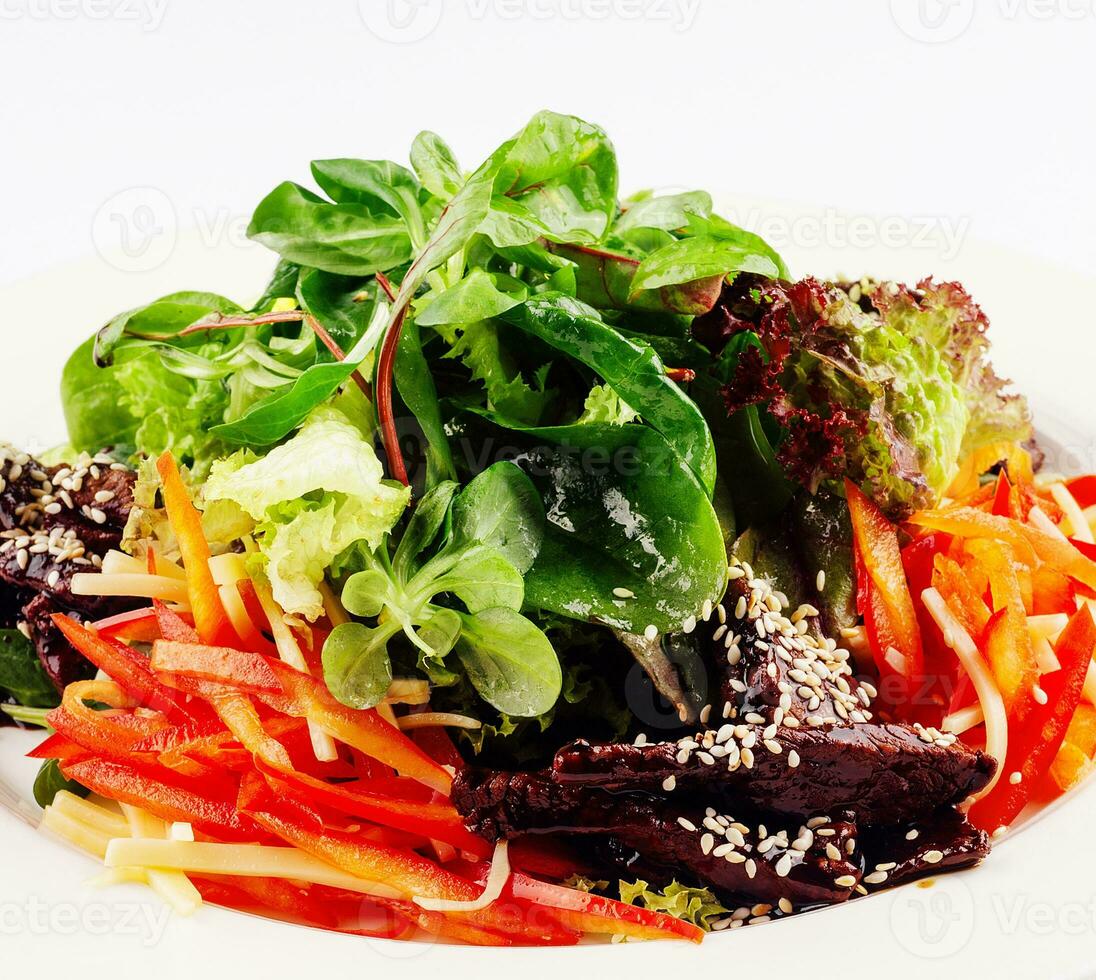 Slice fresh vegetables on the white plate photo