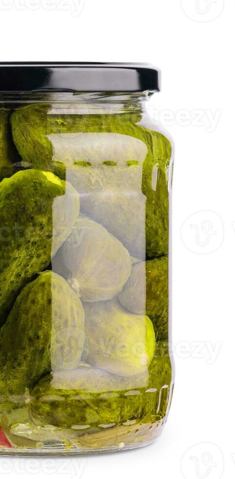 A glass jar of tasties canned cucumbers on white background photo