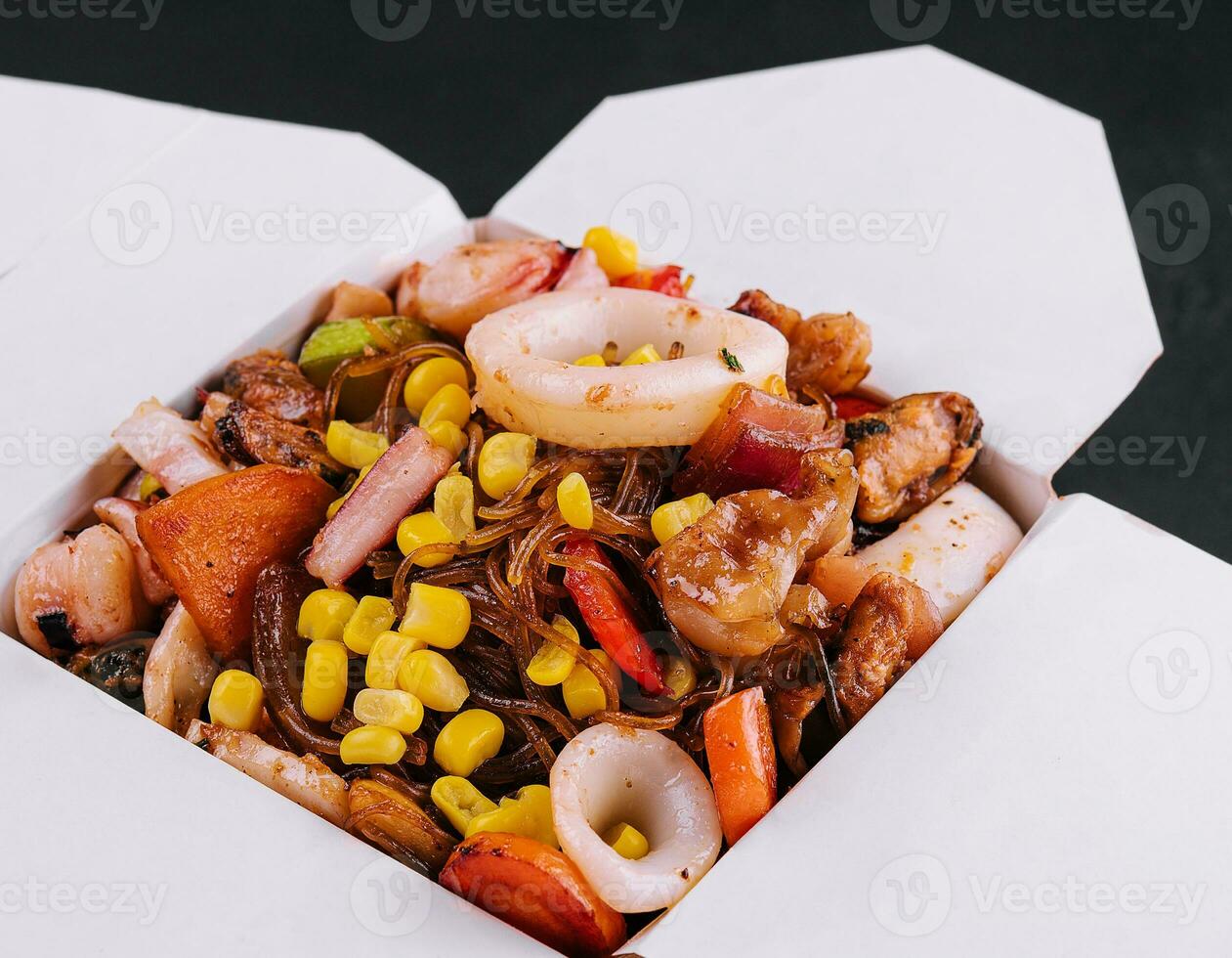 Stir-fried noodles with seafood and vegetable in asian style photo