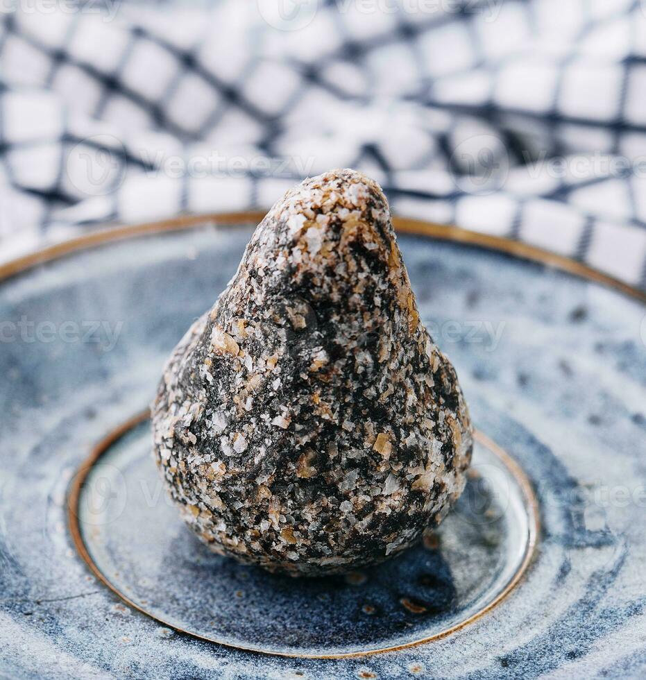 sweet handmade chocolate truffle on plate photo