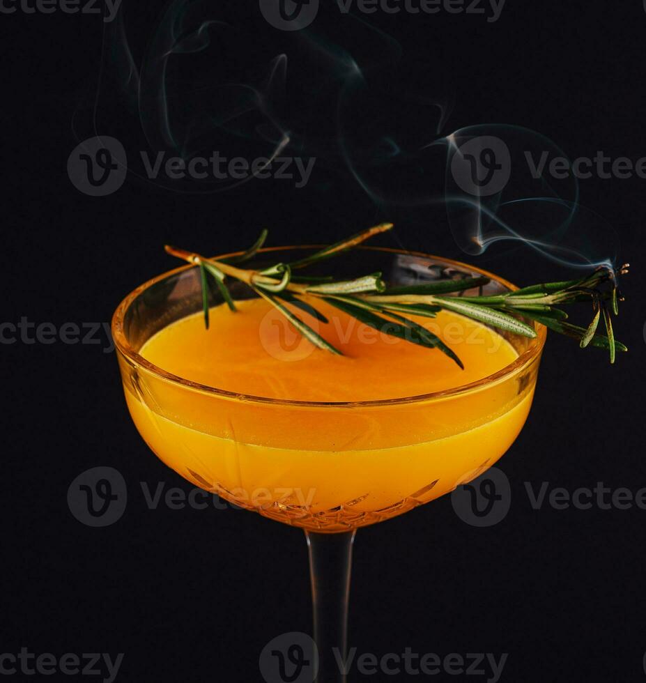 Rosemary cocktail - golden rum, rosemary, fruits juice and syrup photo