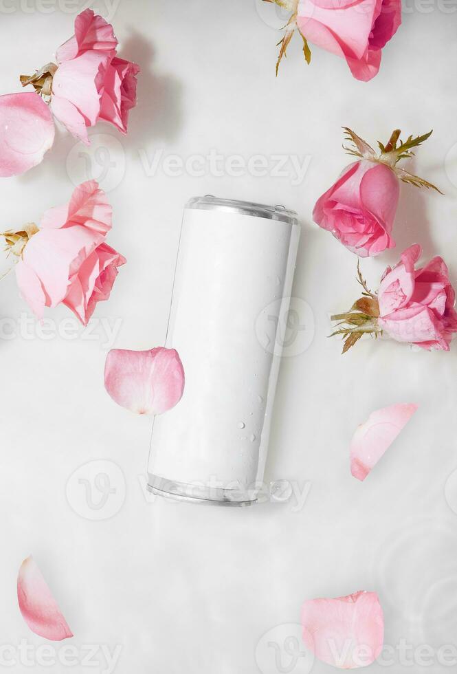 Wet metal aluminum beverage drink can with rose petals photo