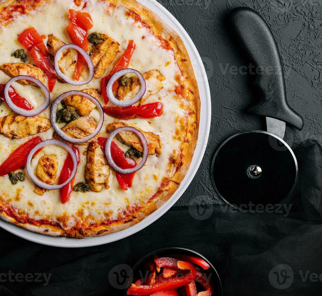 Fresh barbecue chicken pizza with vegetables photo