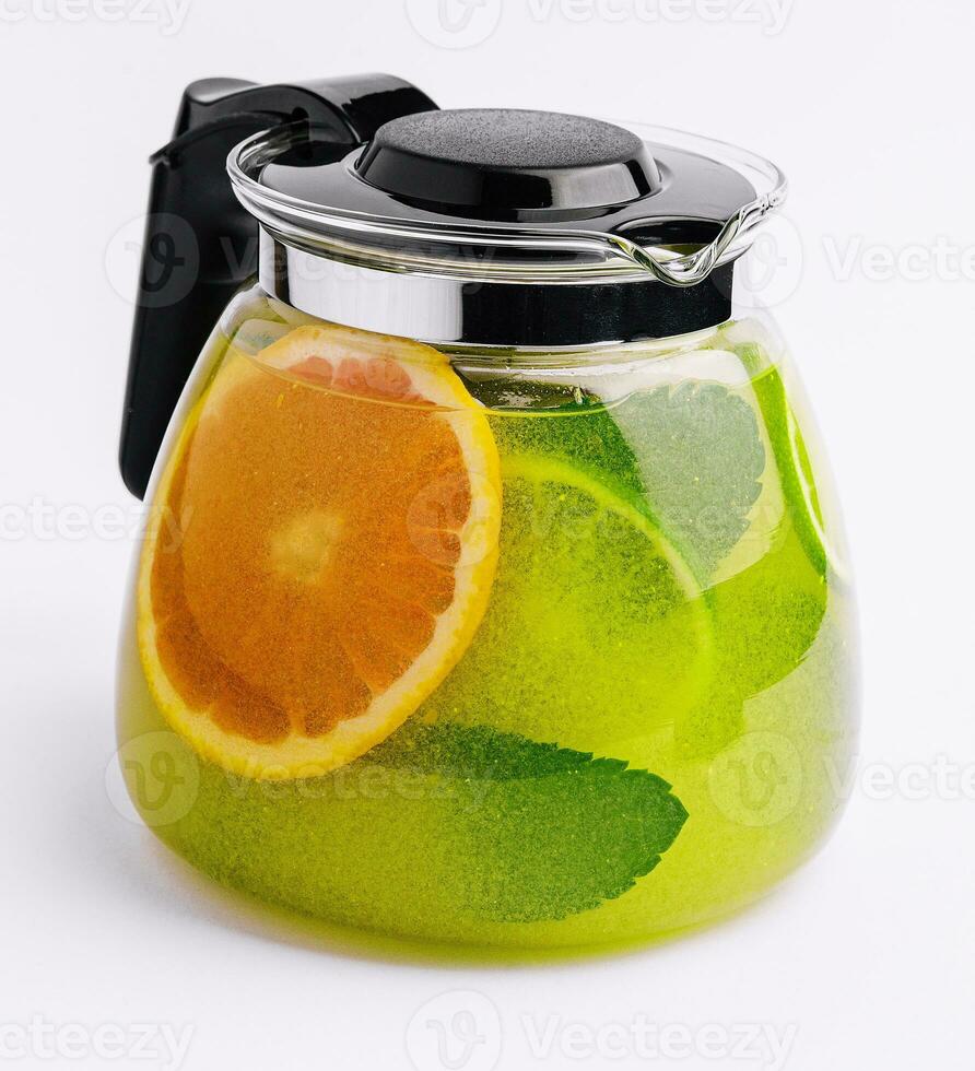 refreshing tea with lime and orange and mint photo