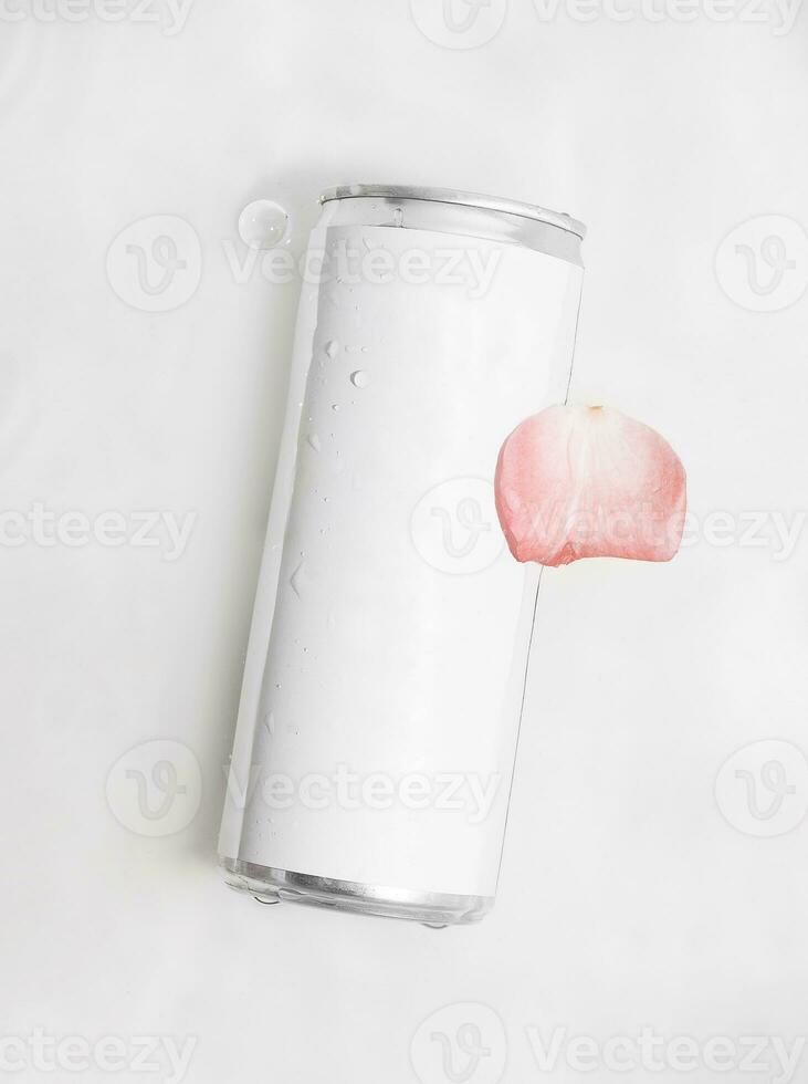 Wet metal aluminum beverage drink can with rose petal photo