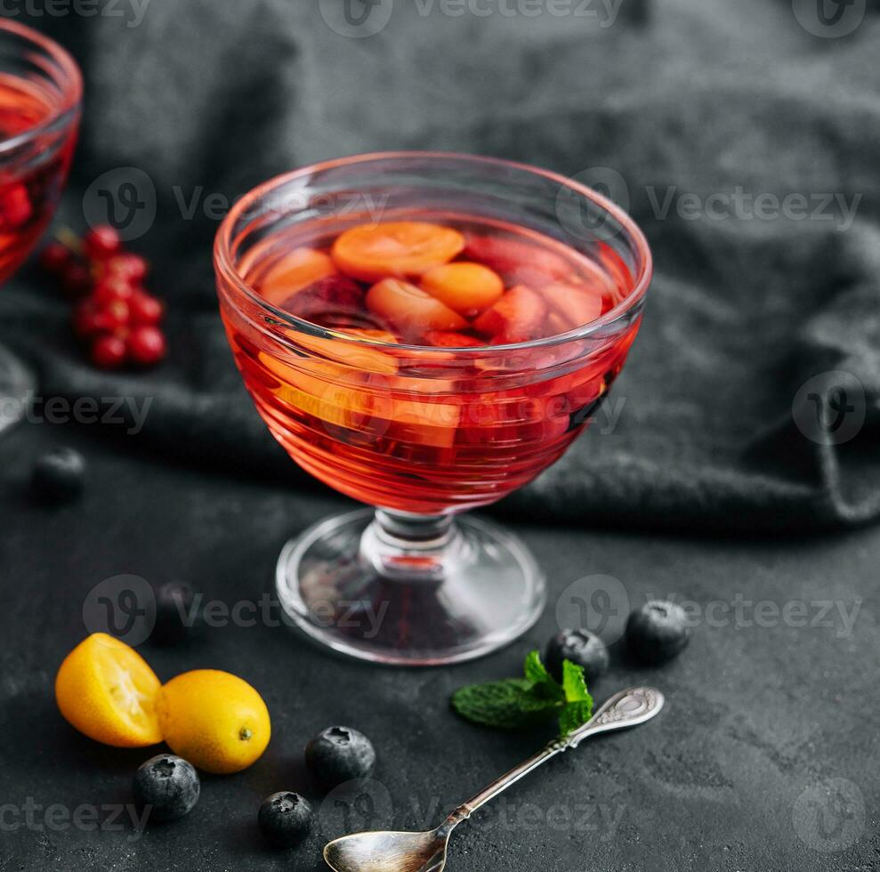 Strawberry jelly with fresh berries and peppermint photo