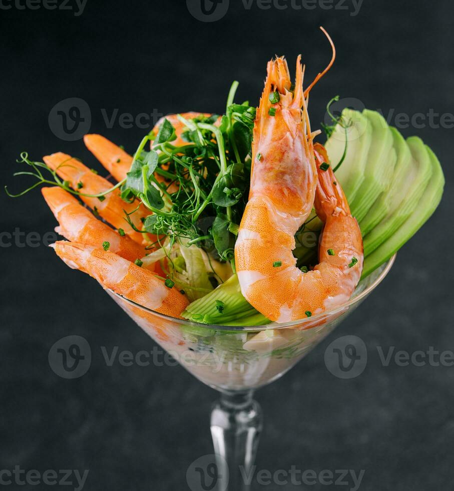 shrimp and avocado pieces in a martini glass photo