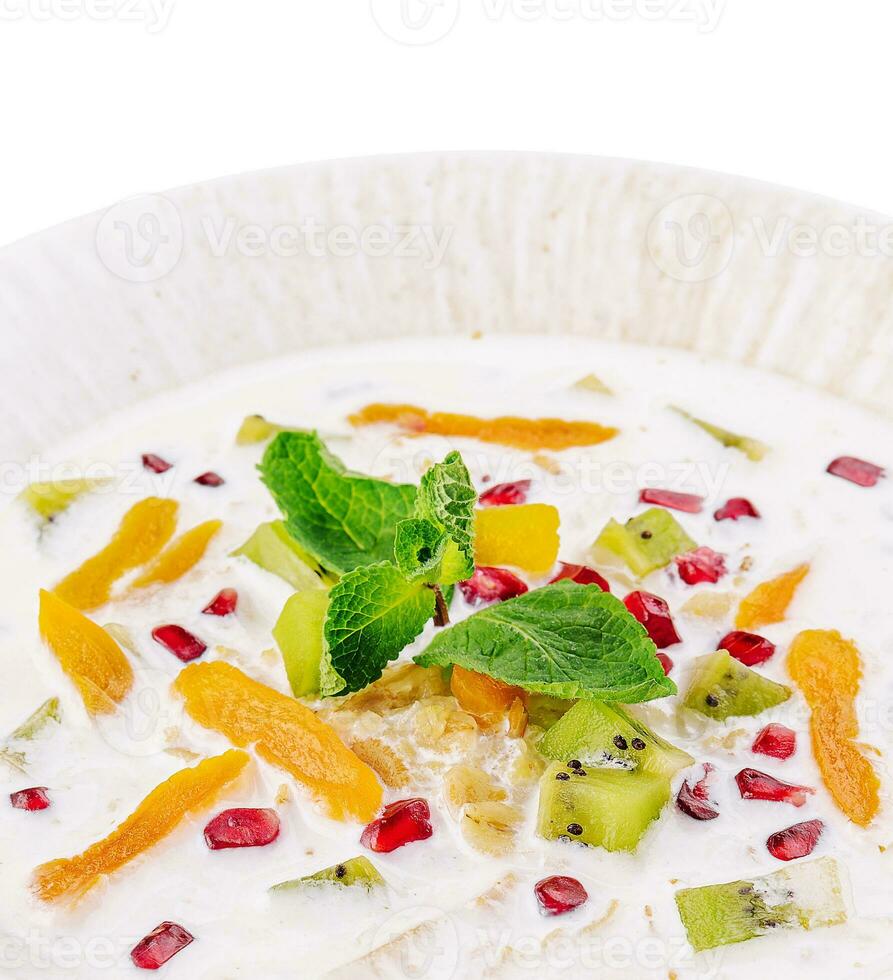 muesli with kiwi, apricot and pomegranate photo