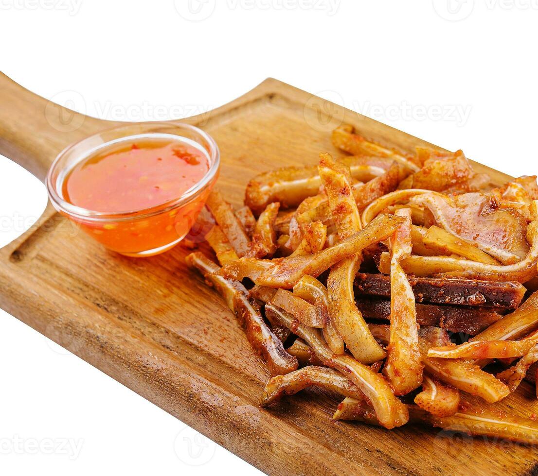 Delicious pork ears snack plate on white photo