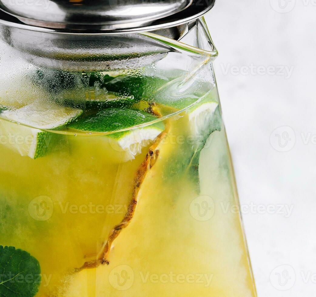 Passionfruit iced green tea or lemonade with lime and mint photo