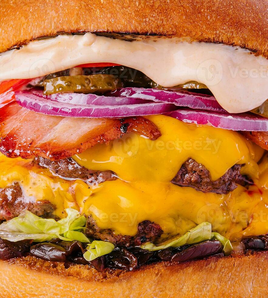 Bacon cheese burger with beef patty tomato onion photo